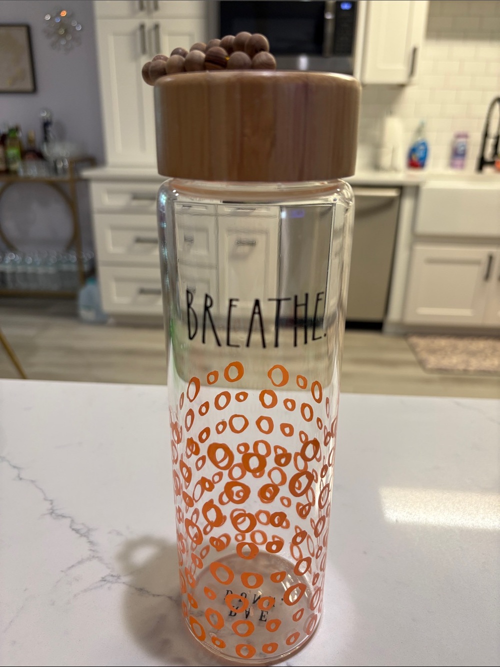 Rae Dunn Clear Glass Bottle with Bamboo Lid and Orange Dot Design